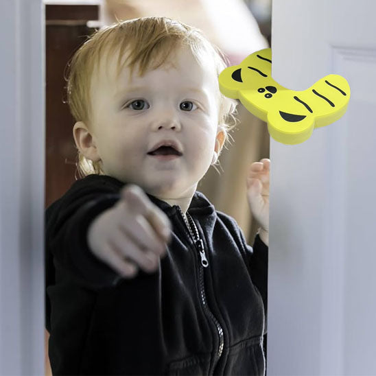 bloque porte forme papillon jaune bébé noir pointe dessus porte