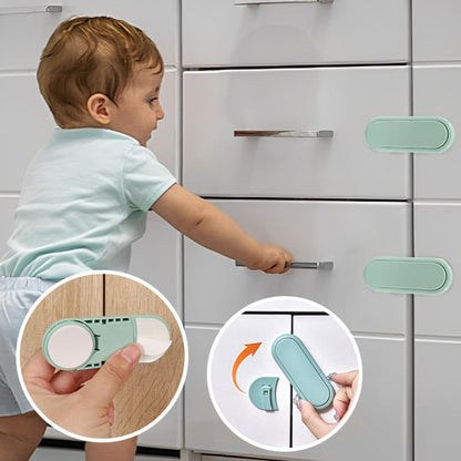 bloque porte vert clair bébé essaie ouvrir tiroir cuisine verrou rotatif